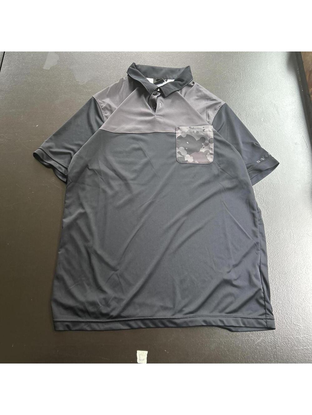Vintage Oakley short sleeve polo featuring a unique gre